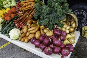 Variety of fresh vegetables on display at a farmer's market, late spring in northern Illinois, USA